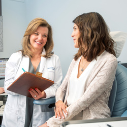 Dr. Alexandra George consulting with a patient
