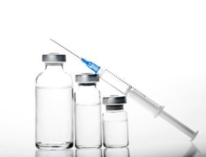Is Botox the Key to Treating TMJ Disorder? Generic bottles of clear liquid and medical syringe