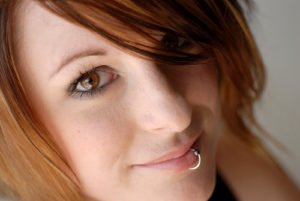 All About Oral Piercings attractive woman with lip piercing