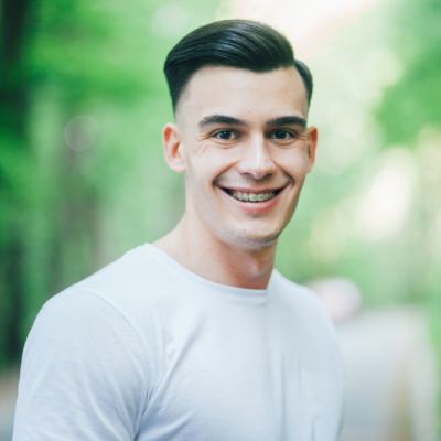 Man smiling with braces