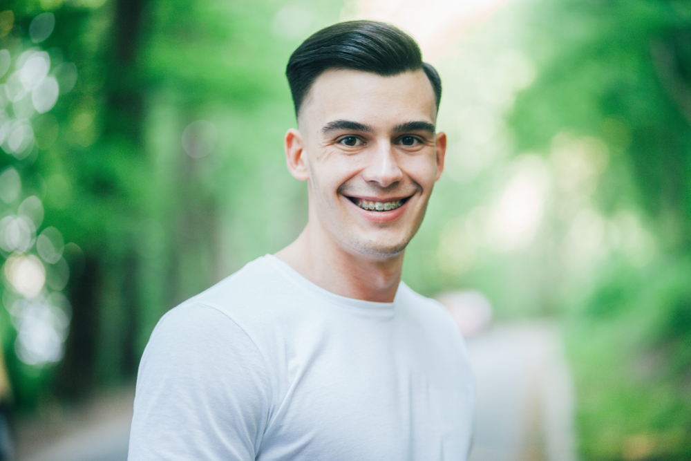 Man smiling with braces